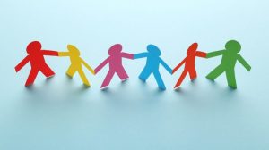 Colorful paper chain people on blue background